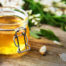 Jar of acacia blossom honey for nourishing and moisturizing cosmetic applications